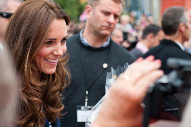Kate Middleton greeting the public in a 2014 photo.