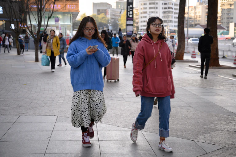 Two women in a Yunnan shopping street.