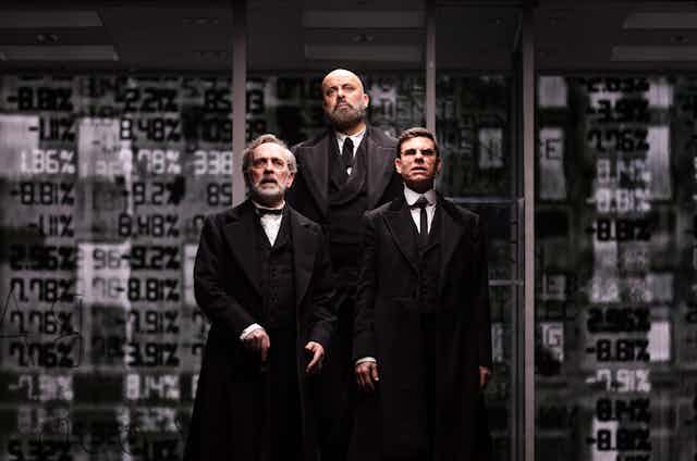 Three men in black suits