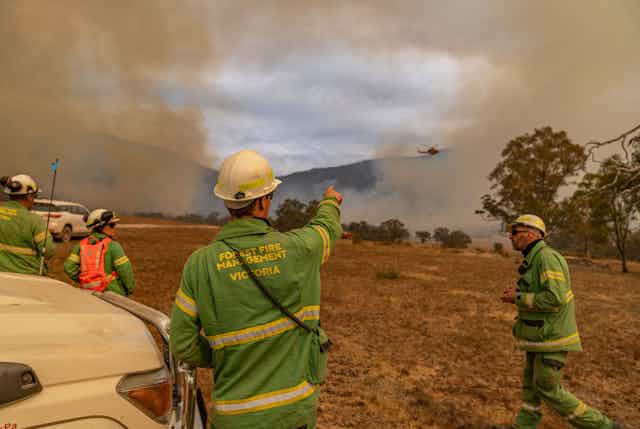 firefighters respond in smoky landscape