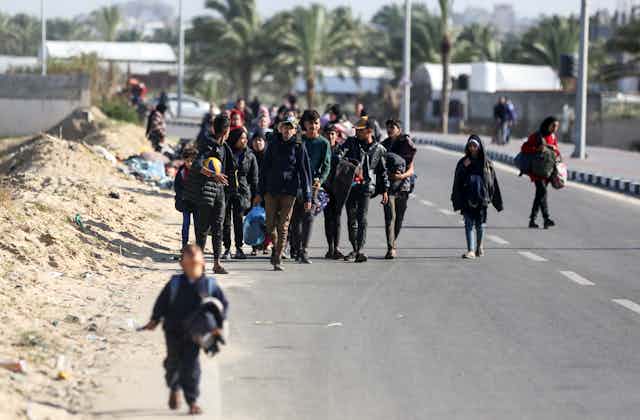 refugees on a road in Gaza