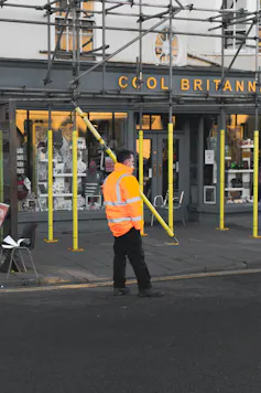 Workman by some scaffolding
