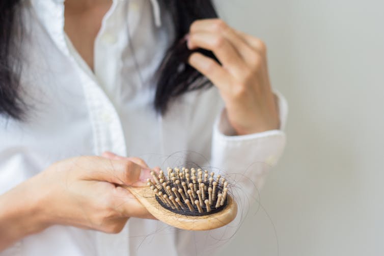 A woman saw hair in her hairbrush.