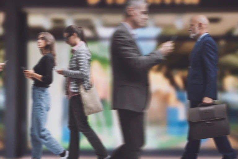 Blurry image of several people shopping