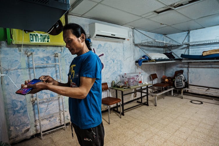 A man stands in a bombs shelter.