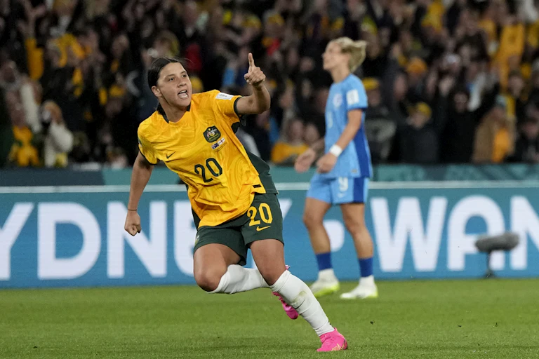 Matildas star Sam Kerr celebrates on the football field.