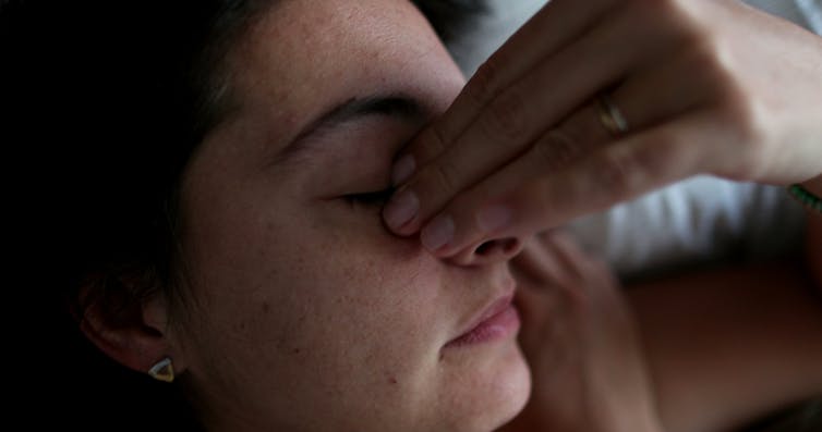 Tired, stress woman with hand over face