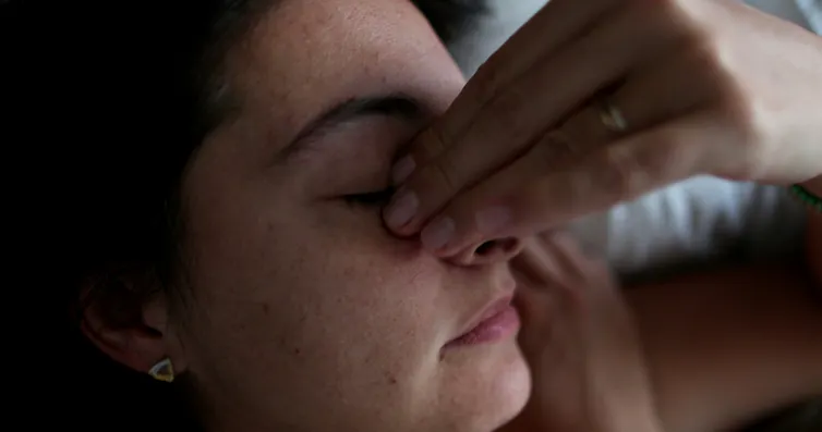 Tired, stress woman with hand over face