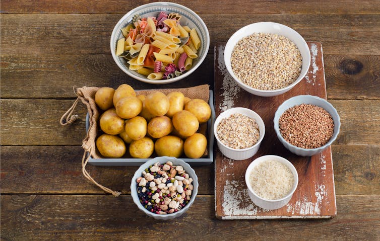 An assortment of carbs, including potatoes, pasta and porridge.