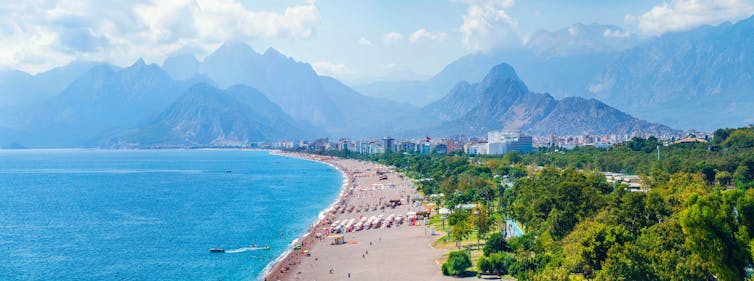 Seaside beach resort with mountains in the distance