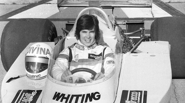 Female F1 racing driver Divina Galica in her car.