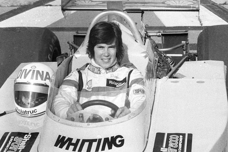 Female F1 racing driver Divina Galica in her car.