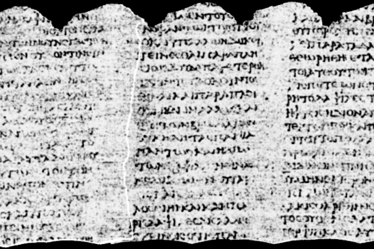 Dense ancient lettering across a scroll.
