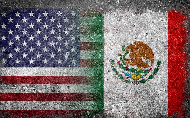 Merged Flag of USA and Mexico painted on grunge concrete