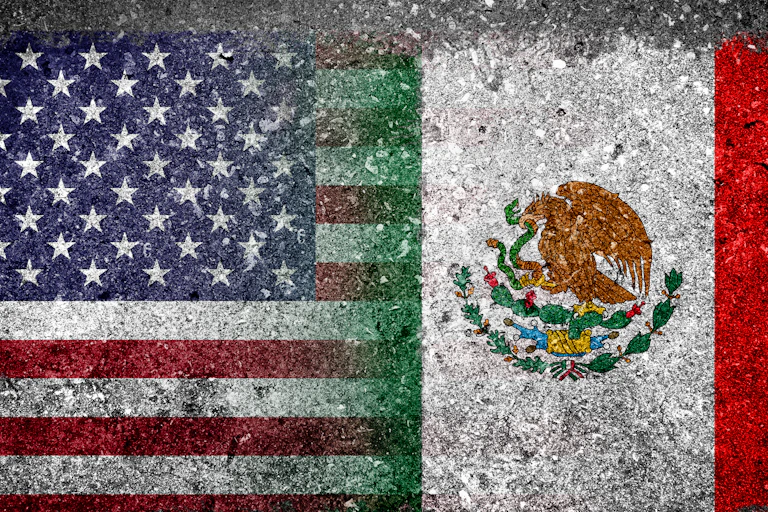 Merged Flag of USA and Mexico painted on grunge concrete