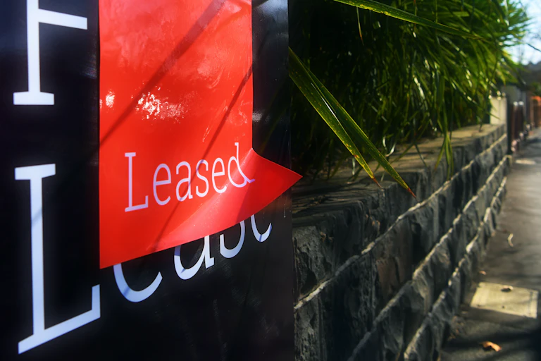 Sign outside home that says "leased".