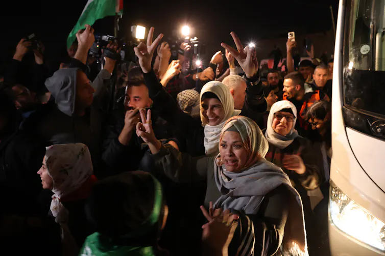 Palestinians in Gaza greeting family and friends being released from Israeli custody, November 2023.
