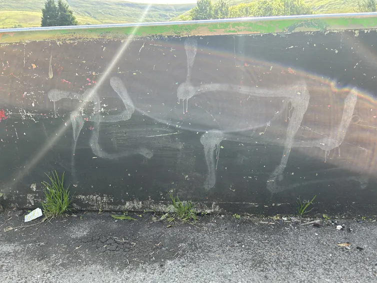 A swastika daubed onto a railway bridge.