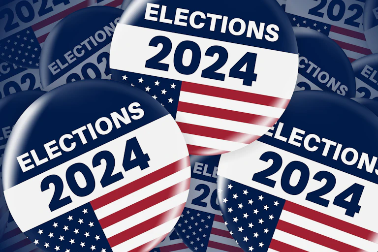 Three US election badges.