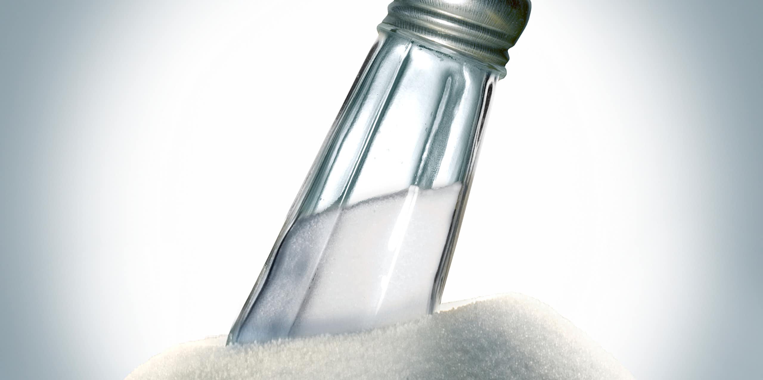Salt shaker embedded in a large pile of salt