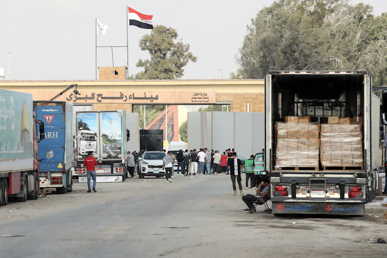 Aid trucks waiting outside the Rafah Crossing from Egypt to Gaza.