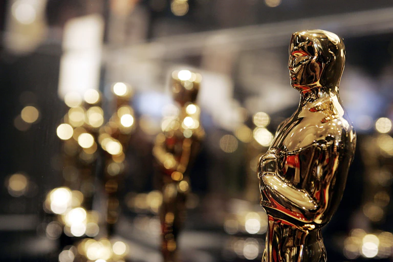 A row of shiny, gold statuettes.