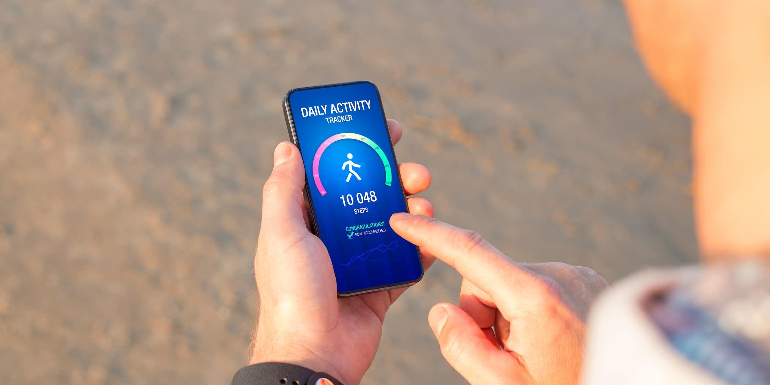 Person looking at an activity tracking app on a smartphone
