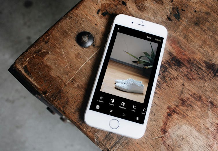 A smartphone with a picture of a shoe on the screen