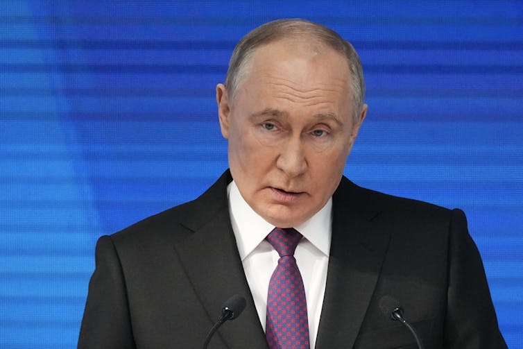 A photo on Putin in a dark suit