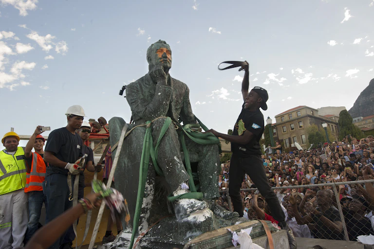 A statue of a man being removed