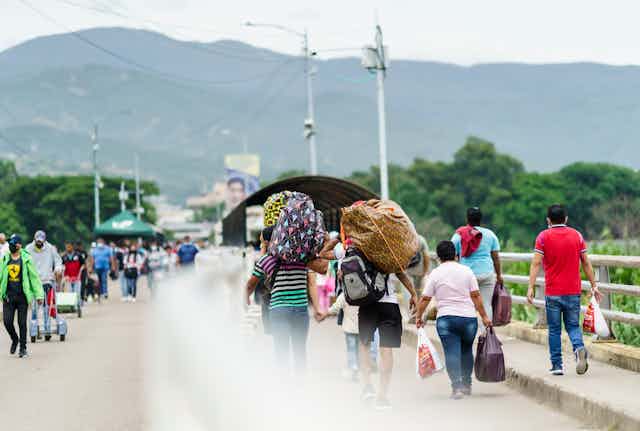 Venezuelans crossing the border into Colombia.