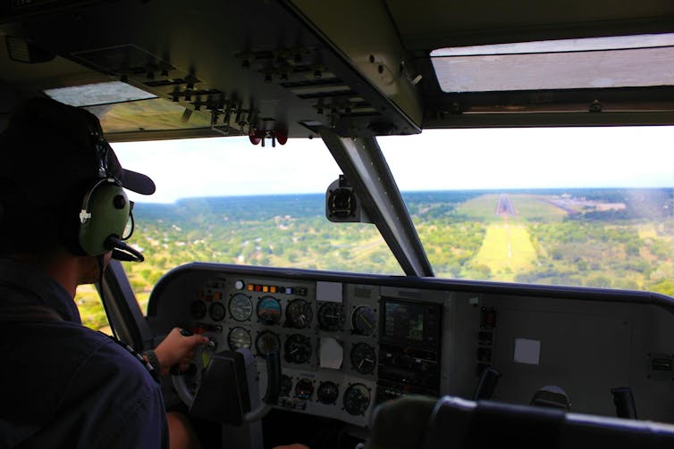 Pilot landing an airplane