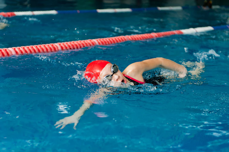 Child swimming freestyle