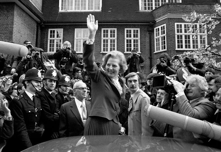 Thatcher waving to her supporters in 1979