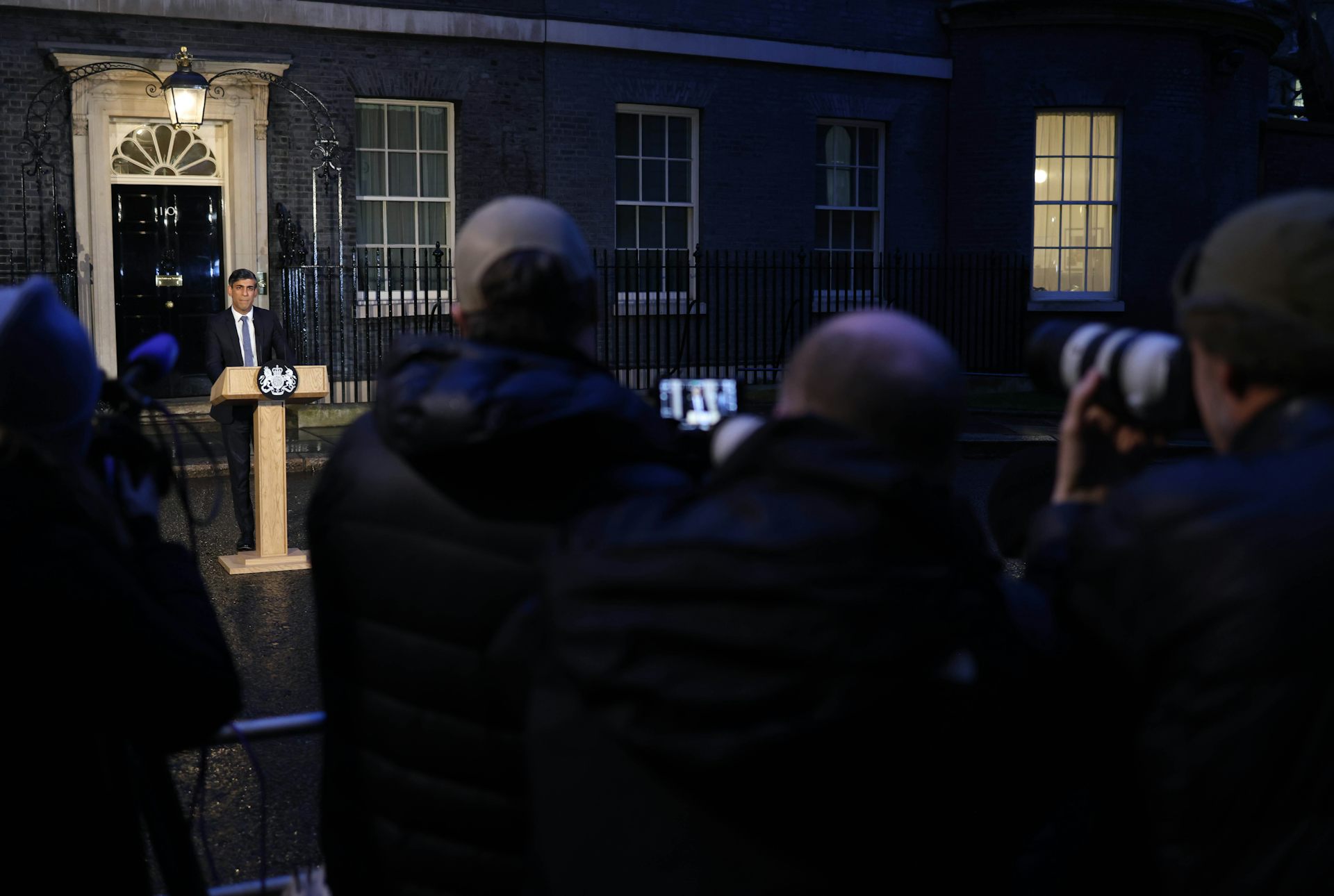 Rishi Sunak standing at a lectern outside 10 Downing Street, in front of members of the press.