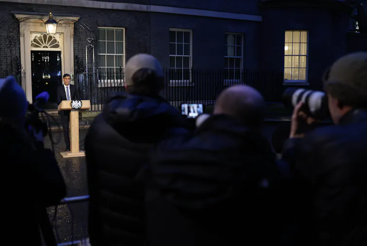 Rishi Sunak standing at a lectern outside 10 Downing Street, in front of members of the press.