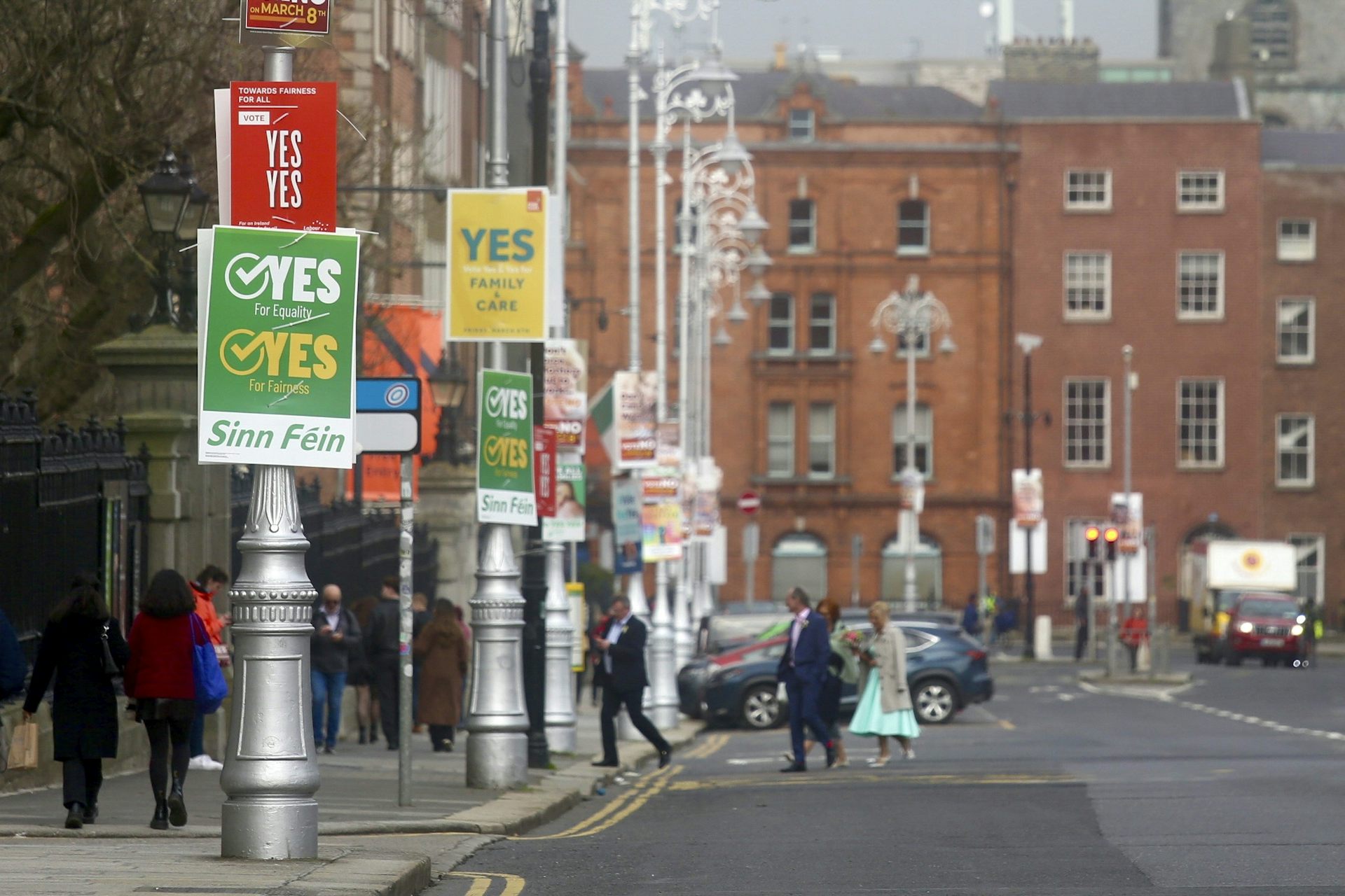 Signs on lamposts urging people to vote 'yes, yes' in the double referendum.