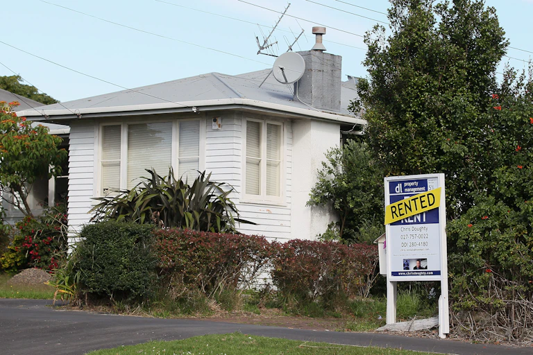 House with rented sign.