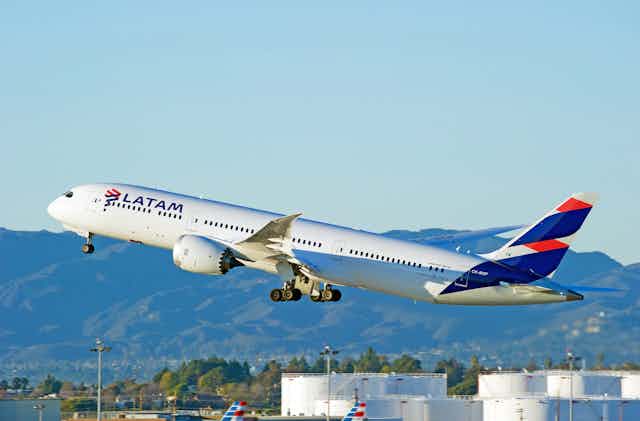A plane marked LATAM taking off.