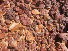 Closeup of the gibber plain showing areas of flat interlocking red pebbles
