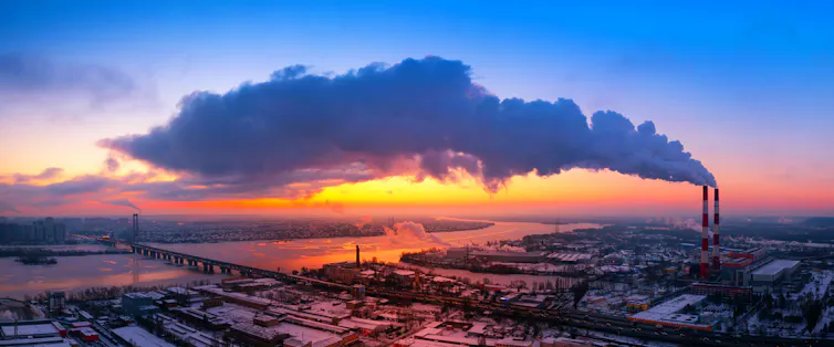 Huge cloud above city coming from large industrial chimney