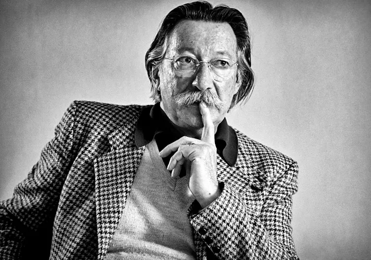 ELIZA's creator, Professor Joseph Weizenbaum in a black and white photograph.