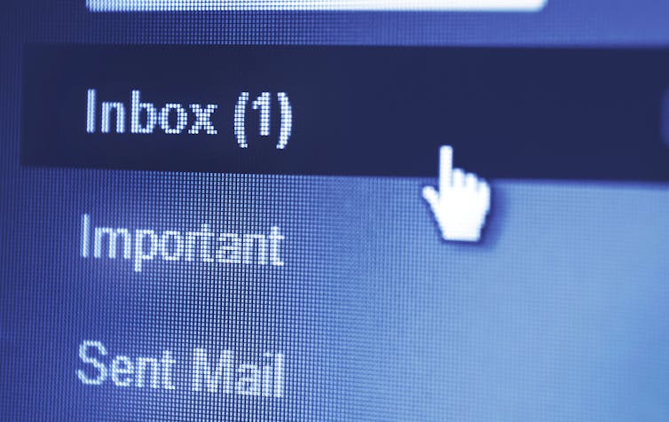 Close-up of a mouse cursor selecting an inbox link with one unread email.