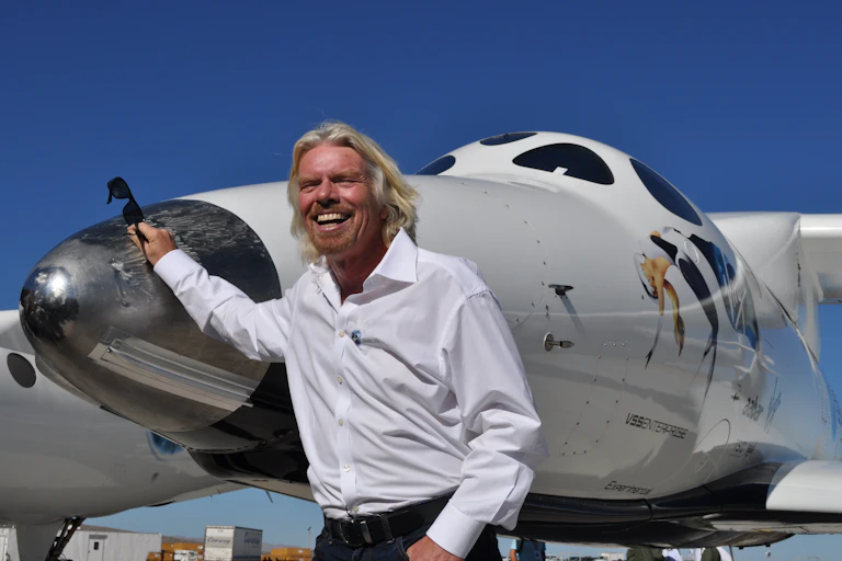 Richard Branson, next to White Knight Spaceship 2.
