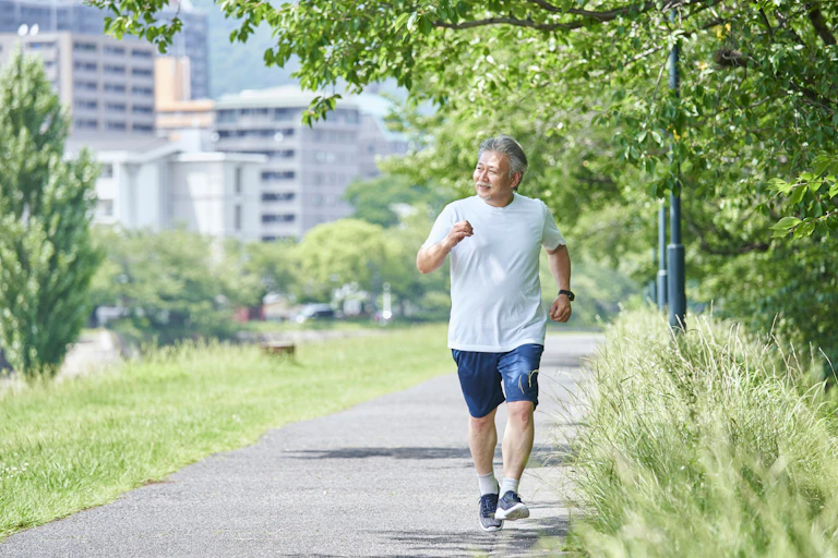 Man walks in a green park