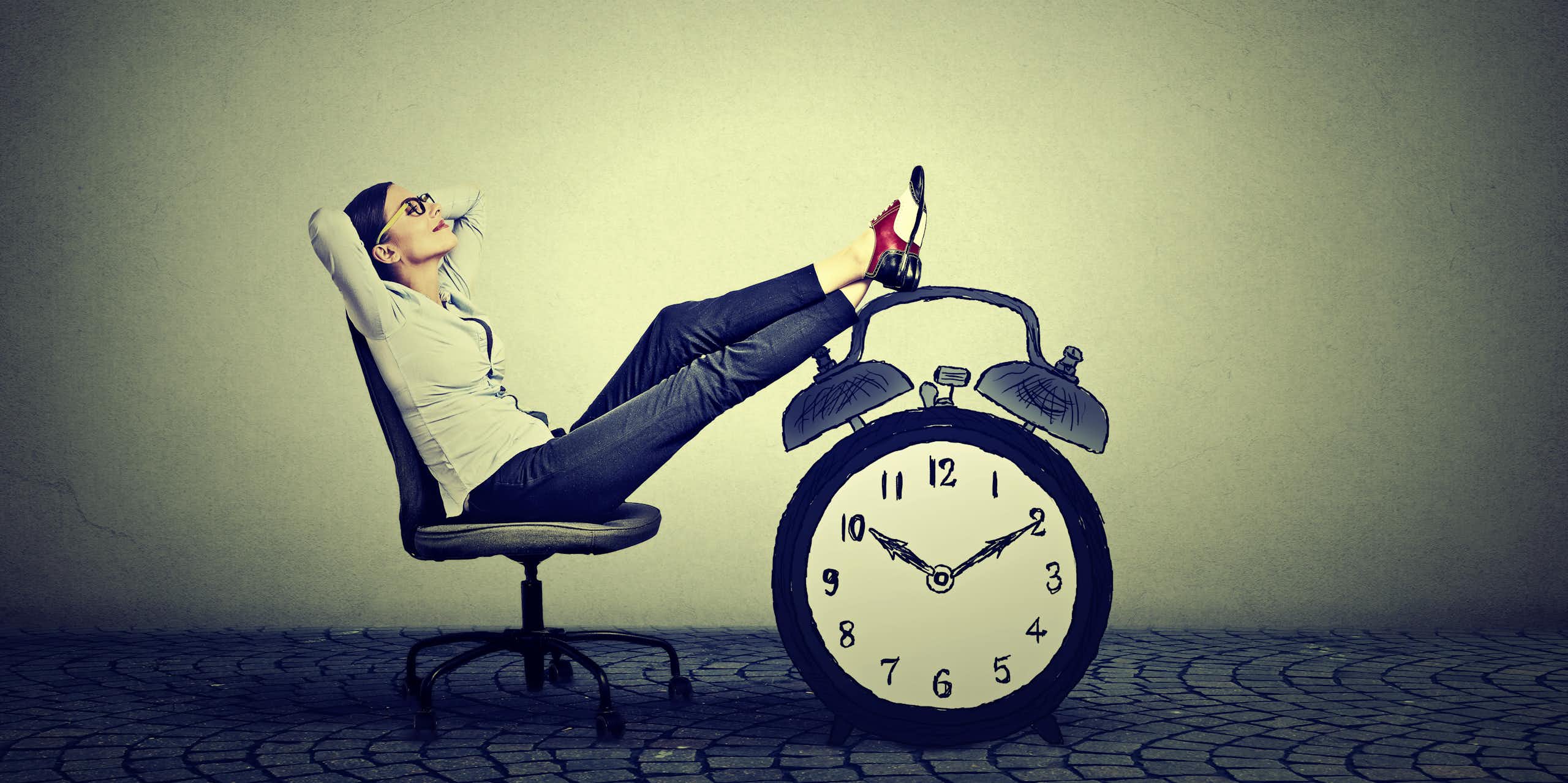 Woman relaxes on chair with feet up on a large clock.
