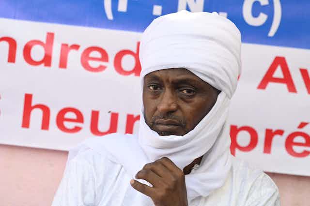 Man dressed in white traditional attire and a turban