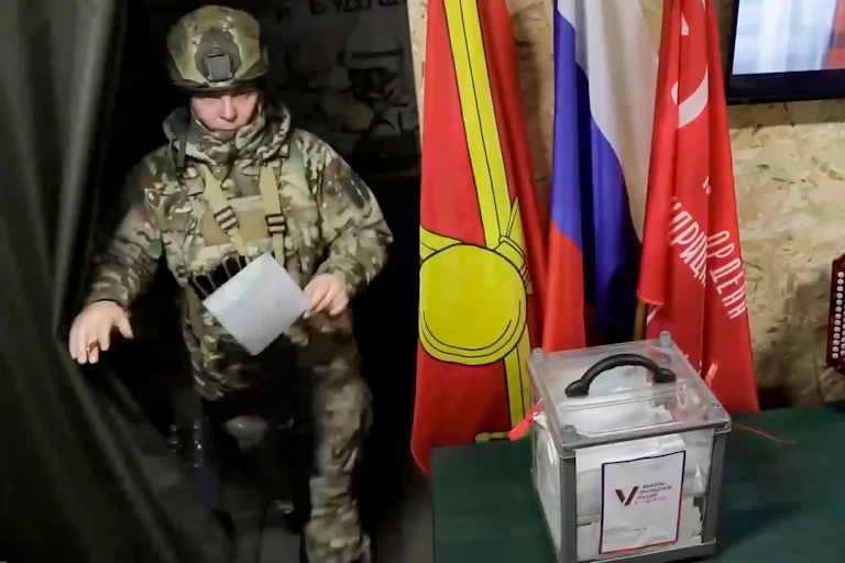 A Russian solcier casts his vote in a Russian-controlled region in eastern Ukraine.