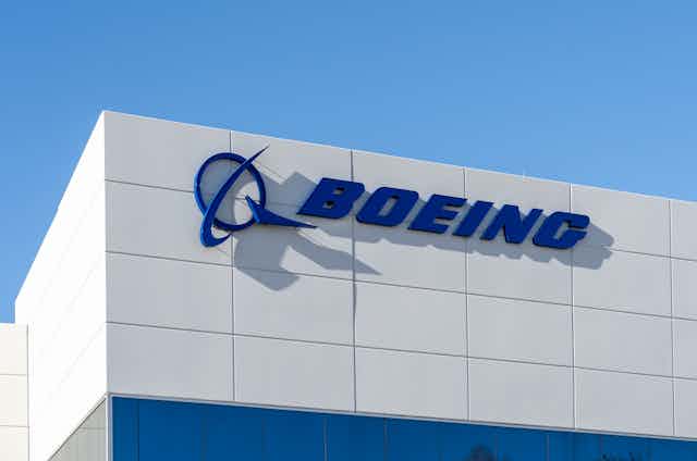 A building with a sign that says 'Boeing' across the front