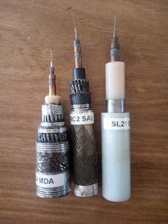 Three small pieces of electric cabling in a row